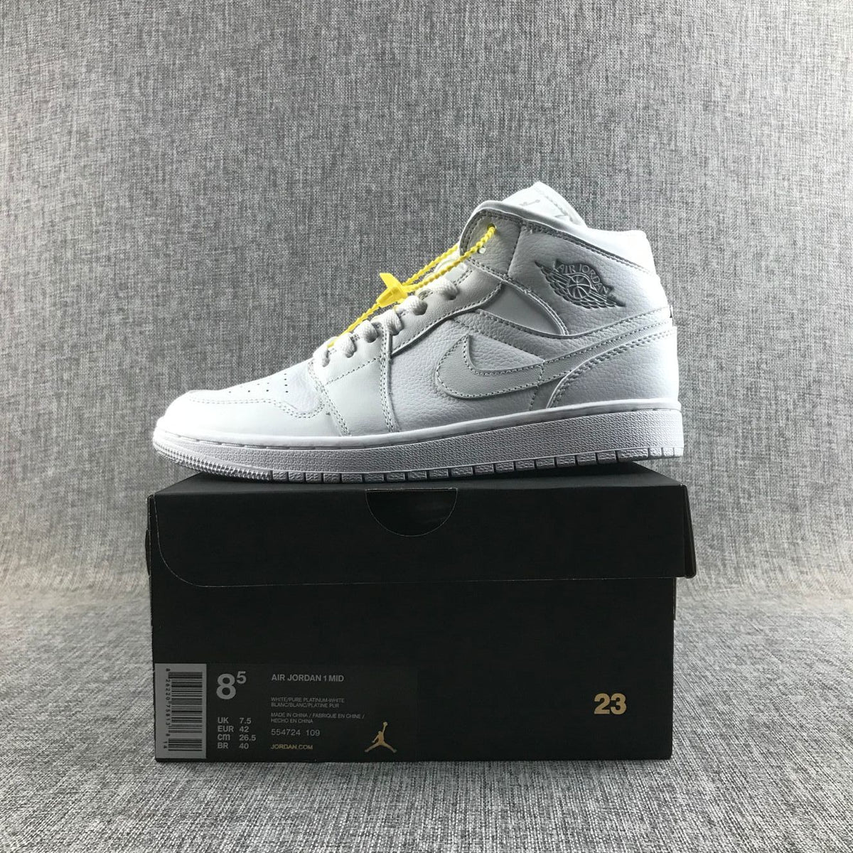 Air Jordan 1 Mid Sneakers in White - product image from the listing.