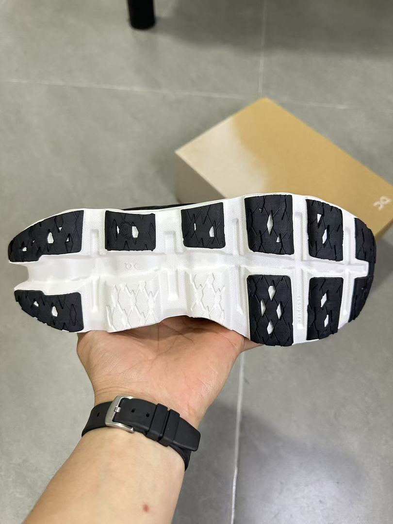 On Running Black and White Road Sneakers for Running - product image from the listing.