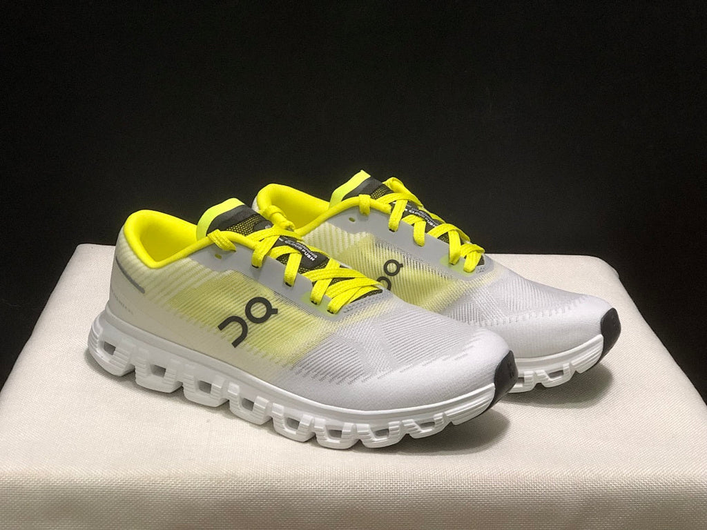 On Cloud 6 Push Sneakers in White and Yellow - product image from the listing.