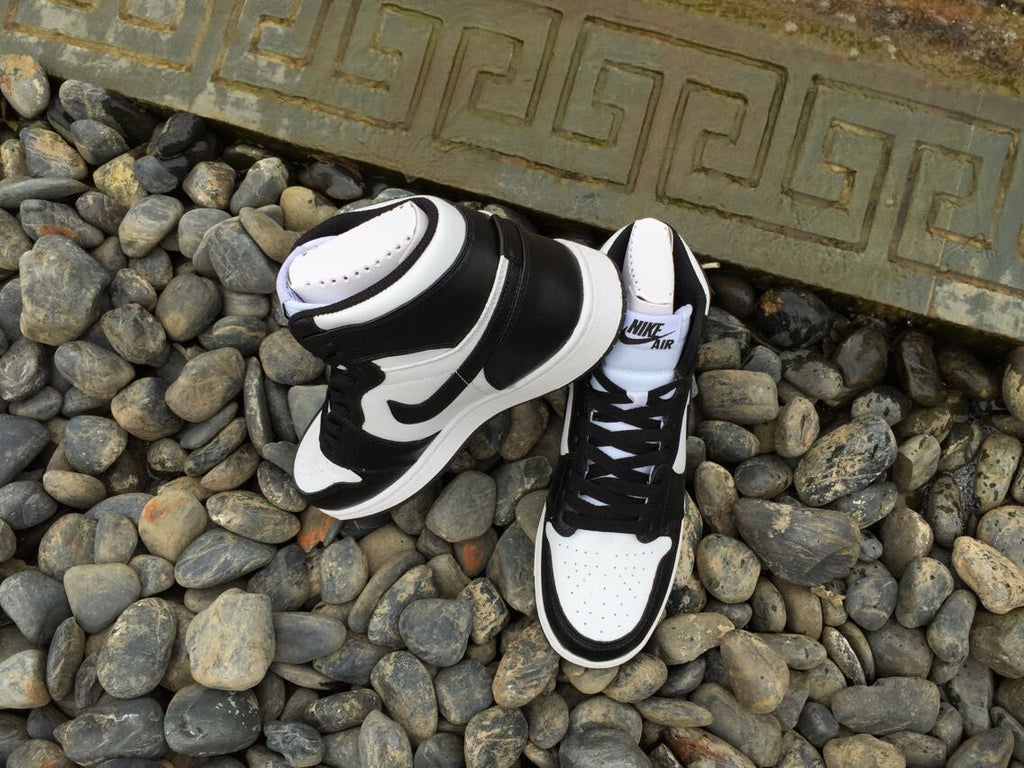 Women's Jordan 1 High Black and White Sneakers - product image from the listing.