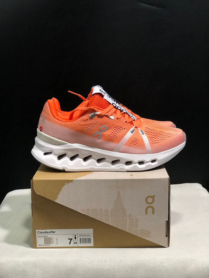 Coral and White On Cloudsurfer Running Shoes - product image from the listing.