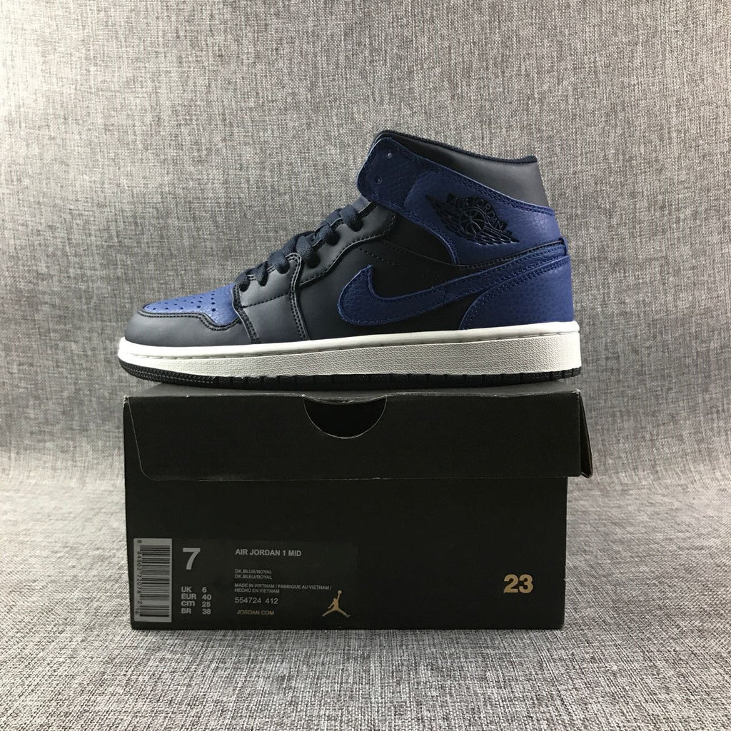 Air Jordan 1 Mid High-Top Sneakers in Black and Royal Blue - product image from the listing.