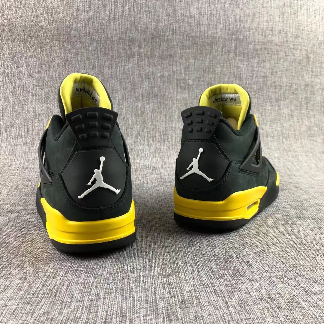 Air Jordan 4 Thunder Black Yellow Sneakers - product image from the listing.