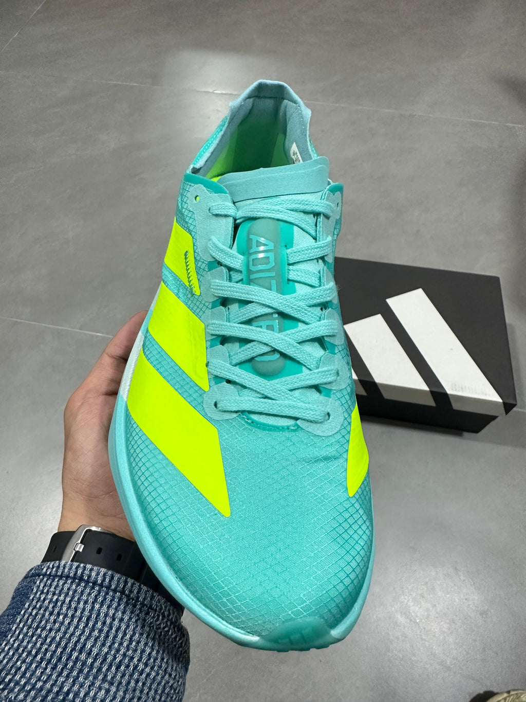 Aqua and Volt Nike Lightstrike Pro Running Shoes - product image from the listing.