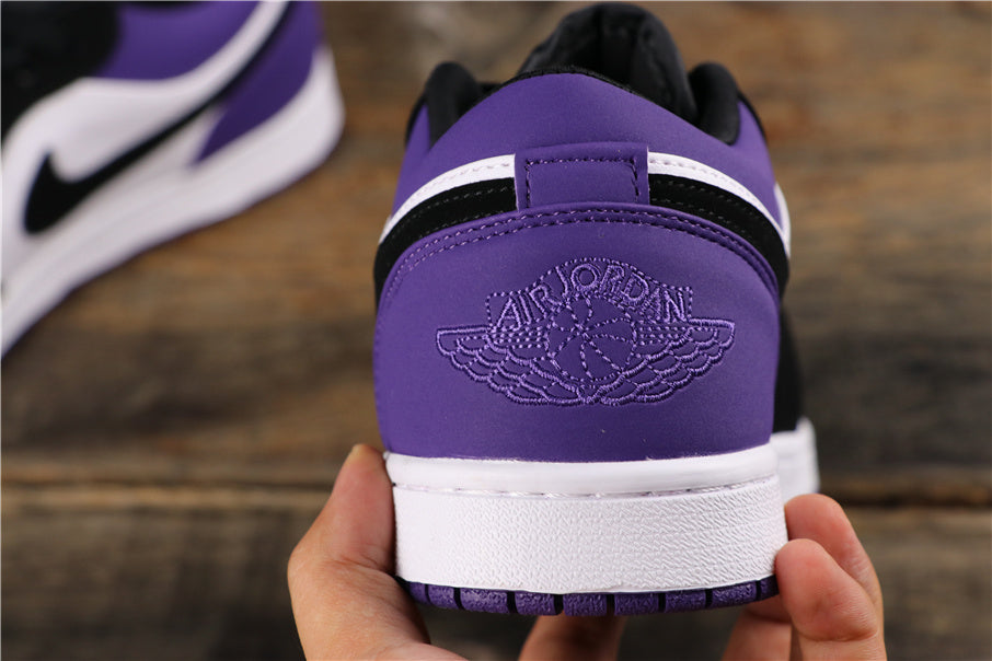Air Jordan 1 Low Sneakers in White Black Orange Purple 553558-125 - product image from the listing.