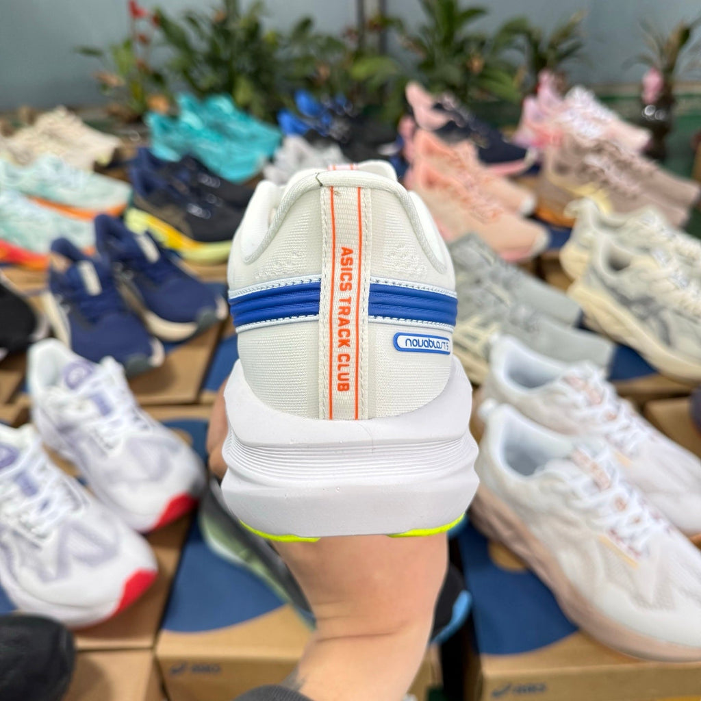 ASICS Novablast 5 LE Running Shoes in White Blue - product image from the listing.