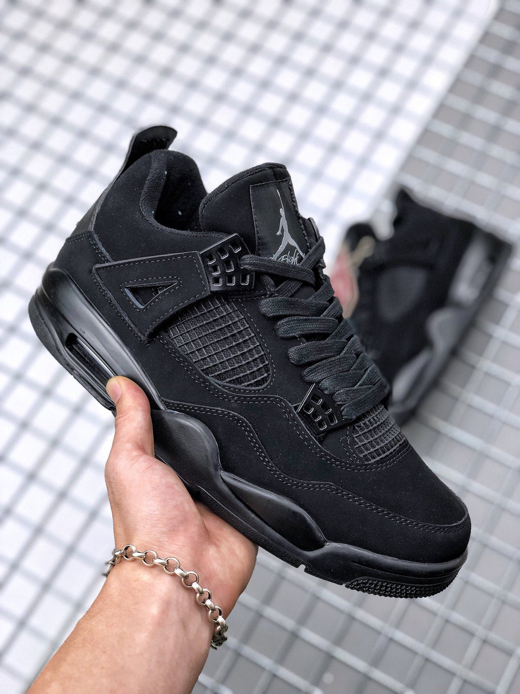 Air Jordan 4 Black Cat Sneakers CU1110-010 - product image from the listing.