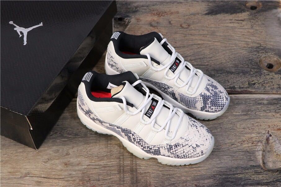 Air Jordan 11 Retro Low White Black Snakeskin Sneakers - product image from the listing.