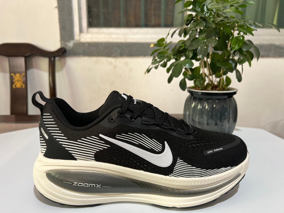 Nike Vomero 18 Running Shoes in Black and White - product image from the listing.