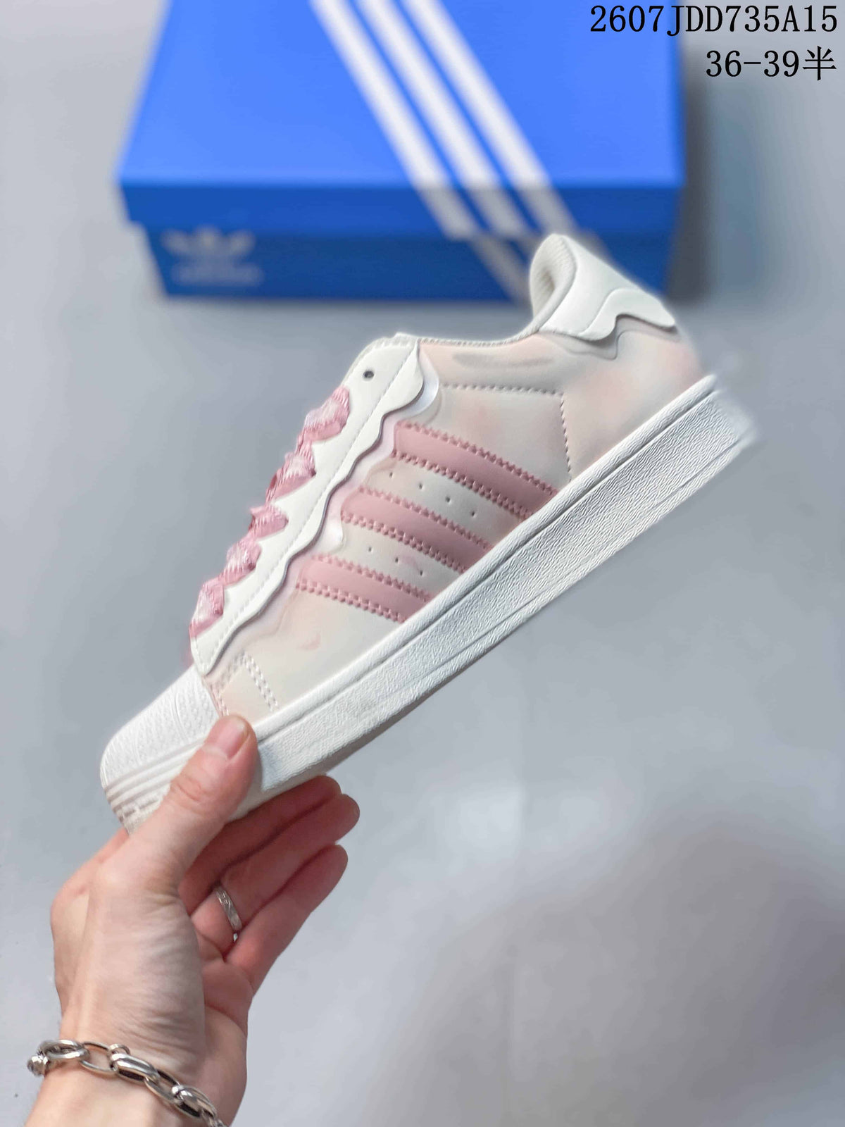 adidas Superstar Sneakers in White and Pink 2607JDD735A15 - product image from the listing.