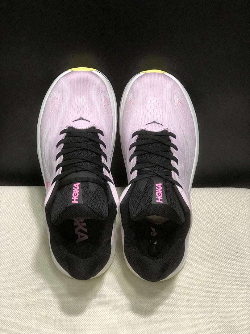 Pink and White HOKA Clifton 10 Running Shoes - product image from the listing.