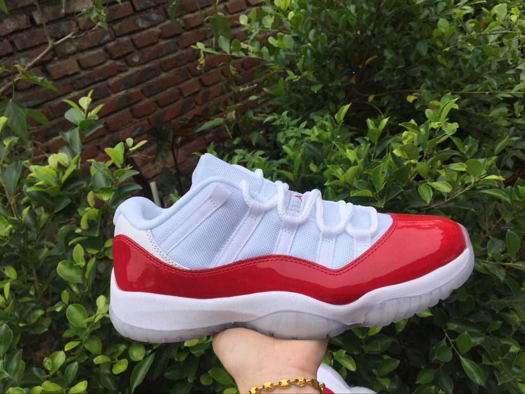 Air Jordan 11 Low Sneakers White Red - product image from the listing.