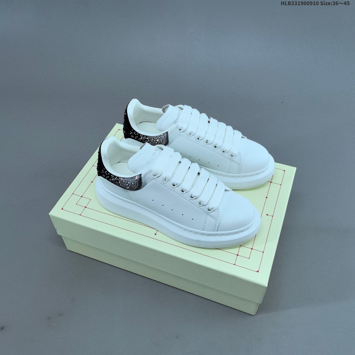 Alexander McQueen Oversized Low-Cut Sneakers with Crystal Heel - product image from the listing.