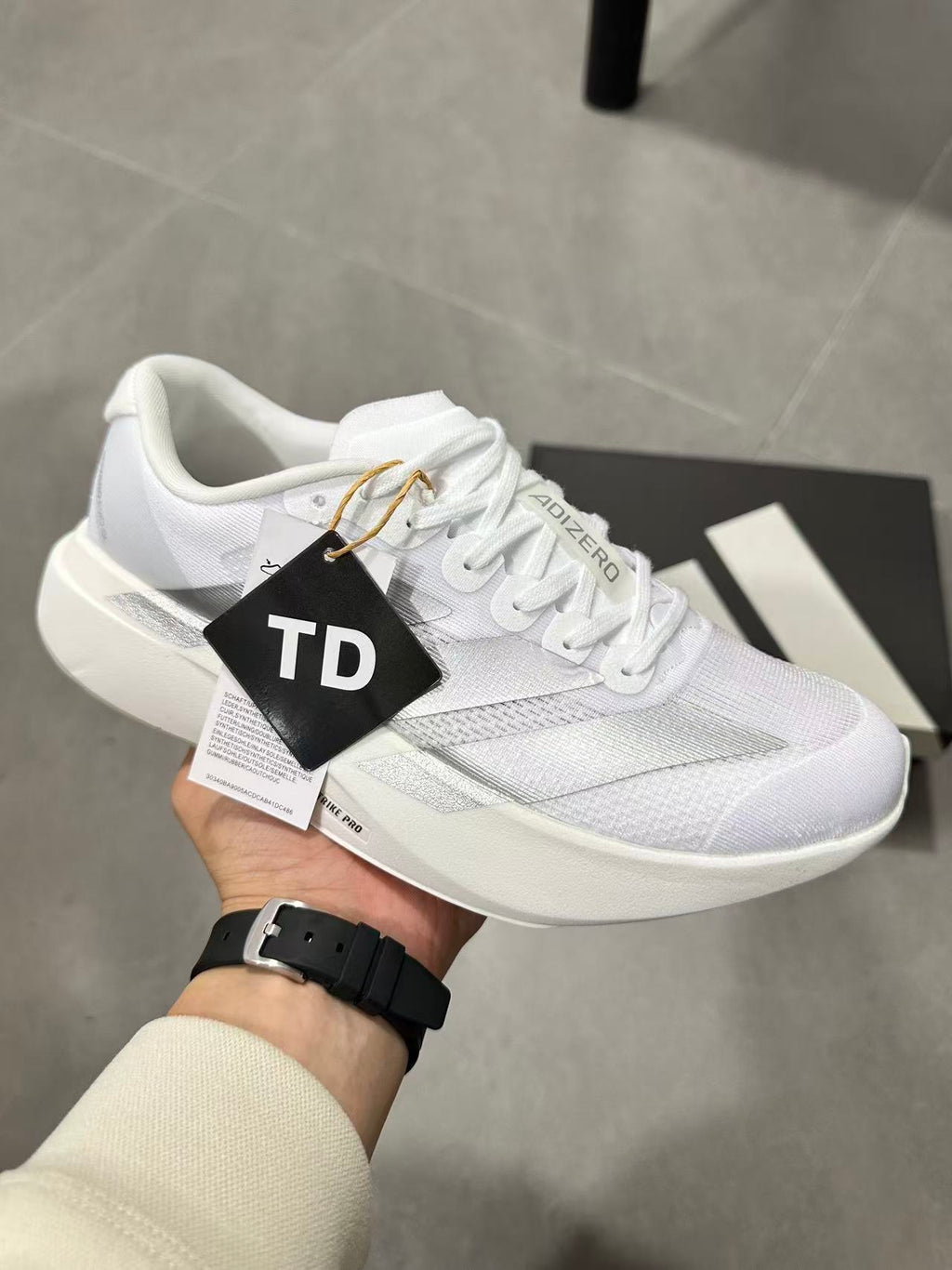 adidas Lightstrike Pro Running Shoes in White JR6207 - product image from the listing.