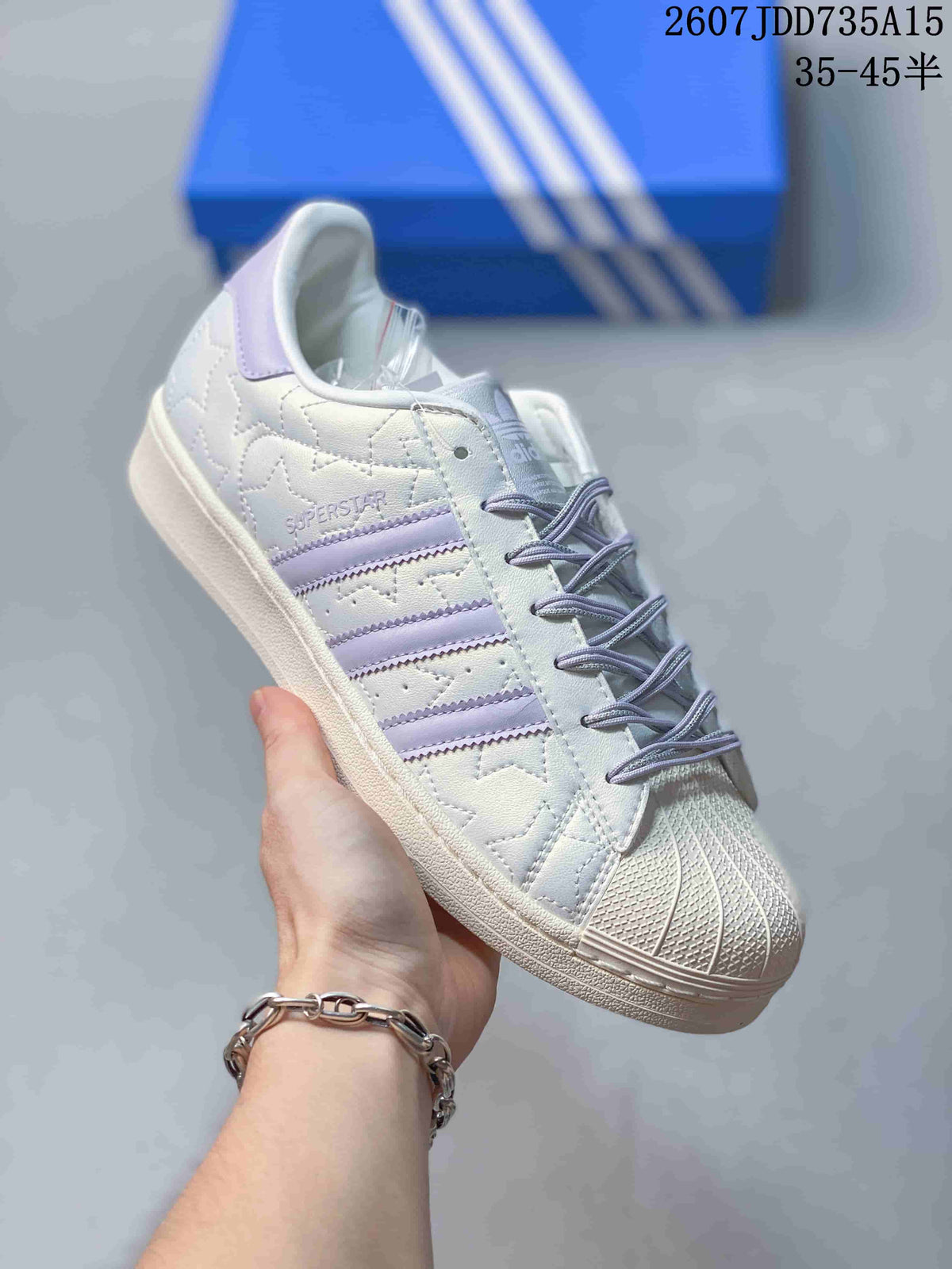 adidas Superstar White and Lavender Shell-Toe Trainers - product image from the listing.