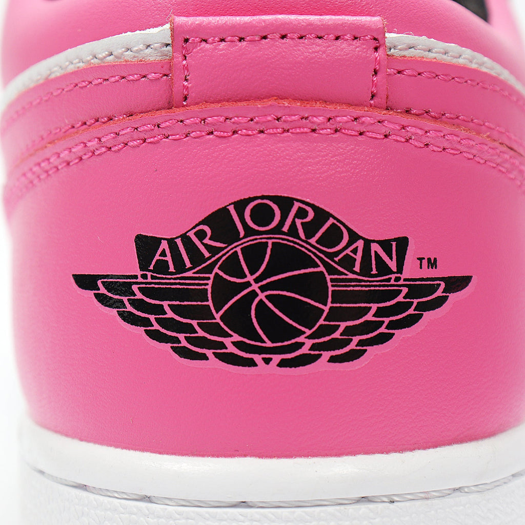 Jordan 1 Low Sneakers in Black Pink White 554723-106 - product image from the listing.
