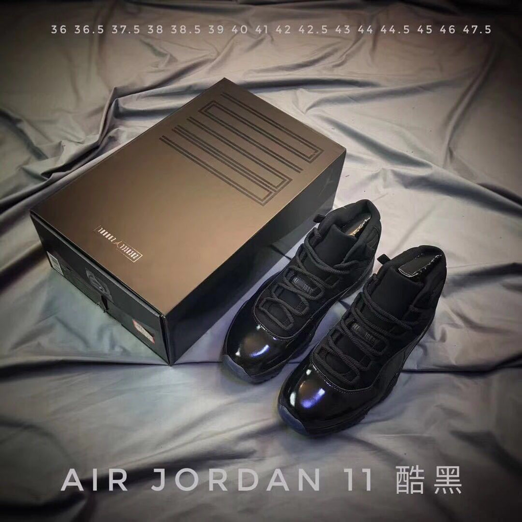 Air Jordan 11 Cap and Gown High-Top Sneakers in Black - product image from the listing.