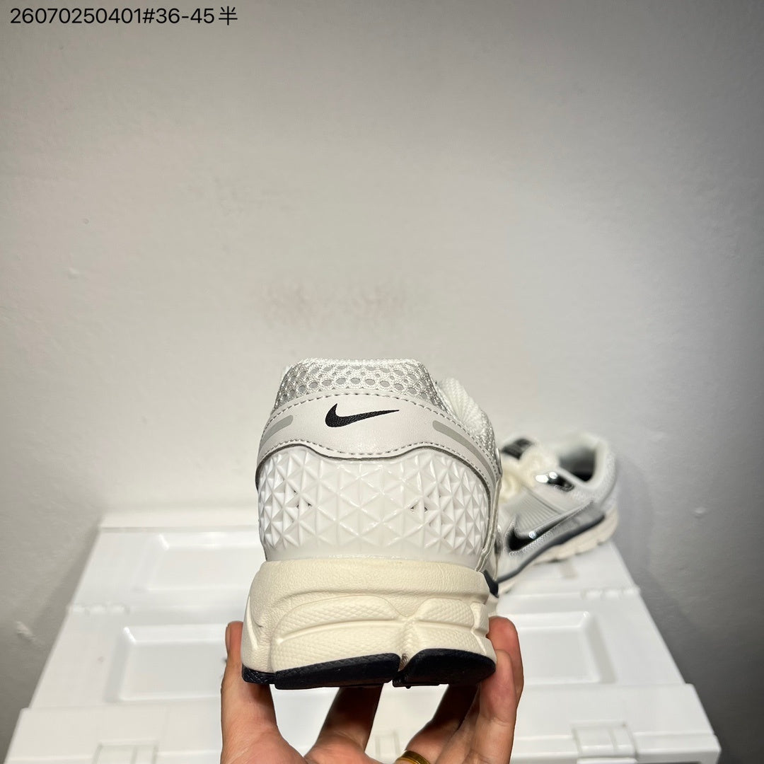 Nike Air Zoom Vomero 5 Sneakers, in White and Black - product image from the listing.