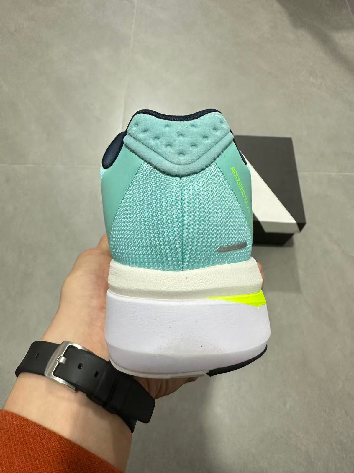 adidas Adizero Lightstrike Pro Running Shoes, in Mint and Black - product image from the listing.