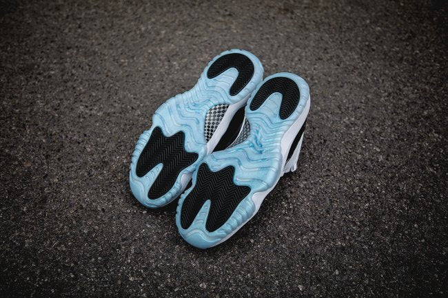 White and Black Air Jordan 11 Iridescent Sneakers - product image from the listing.