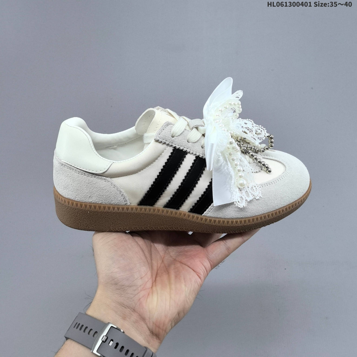 Ribbon and Pearl Bow Low-Cut Sneakers - product image from the listing.