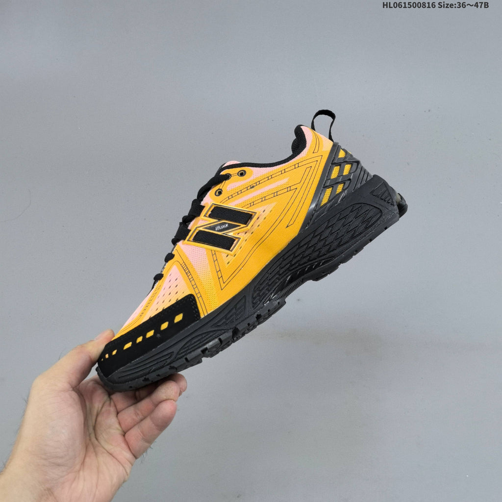 New Balance M1906R Sneakers in Pink Yellow Black U1906596 - product image from the listing.