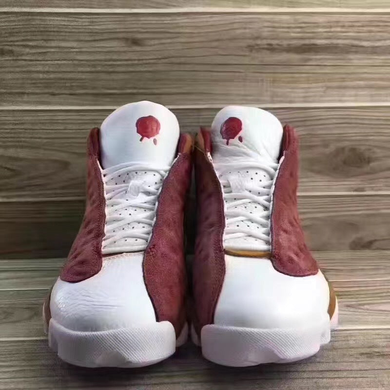 Jordan 13 Sneakers in Burgundy Brown White - product image from the listing.