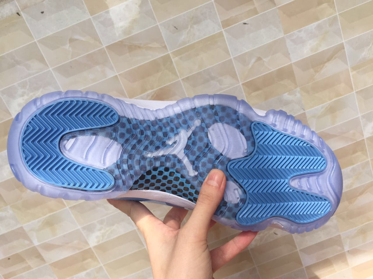 White and University Blue Jordan 11 Low Sneakers - product image from the listing.