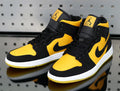 Jordan 1 High Sneakers in Yellow and Black - product image from the listing.