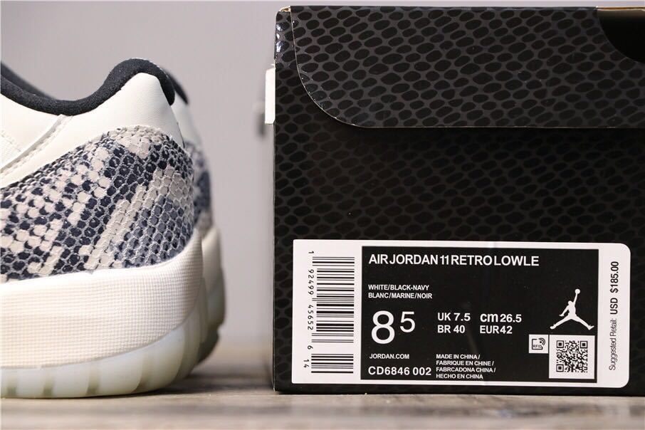 Air Jordan 11 Retro Low White Black Snakeskin Sneakers - product image from the listing.
