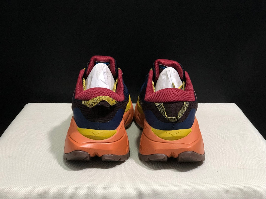 HOKA Skyline Float X Trail Sneakers in Navy Orange - product image from the listing.