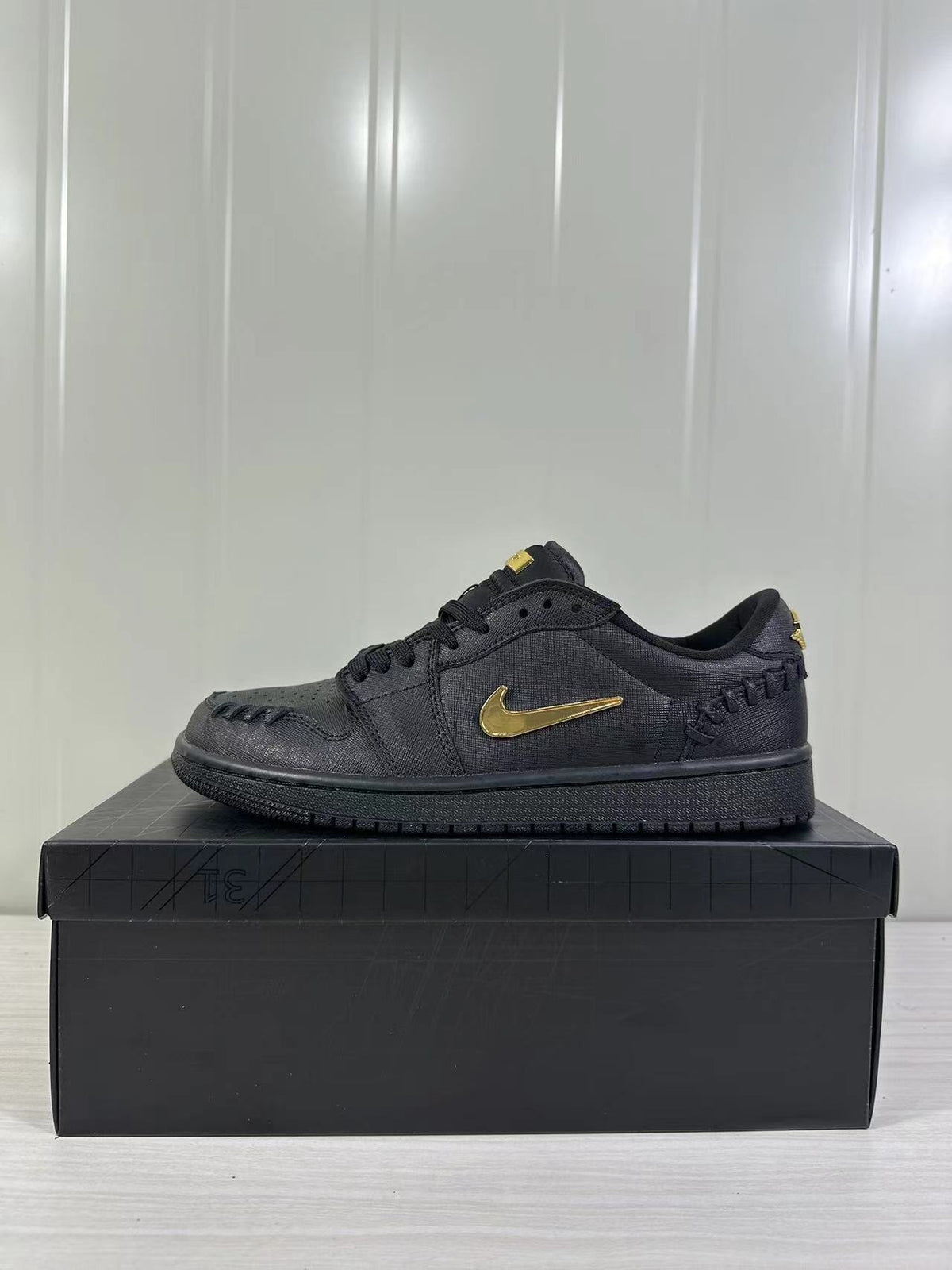 Air Jordan 1 Low Sneakers Black/Gold FN5032-007 - product image from the listing.