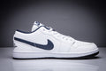 Air Jordan 1 Low White and Black Sneakers - product image from the listing.