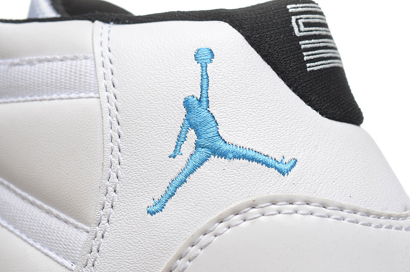 Air Jordan 11 Retro High-Top Sneakers in White and Blue - product image from the listing.