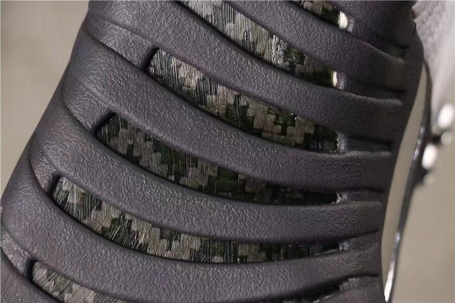 Air Jordan 12 Retro Dark Grey Sneakers in White Black - product image from the listing.