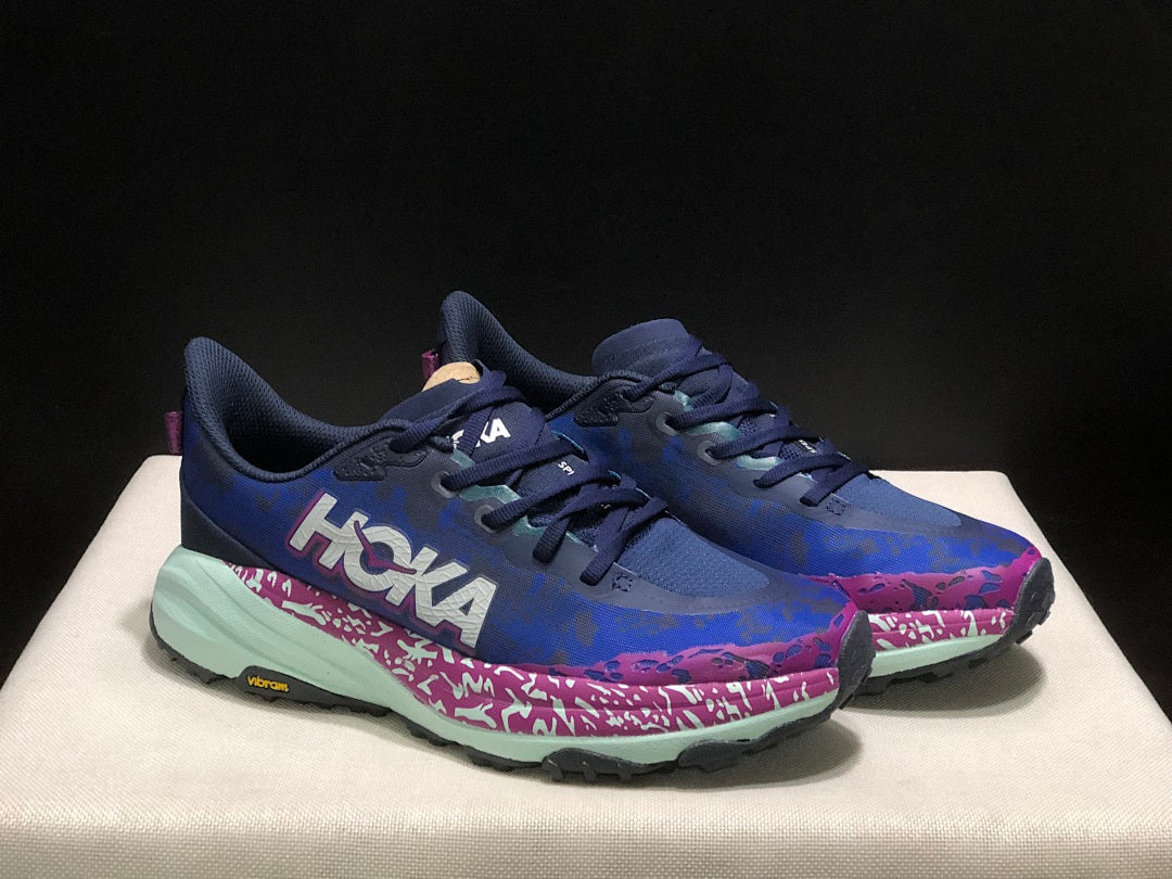 HOKA Speedgoat 6 Trail Running Shoes, in Blue and Pink - product image from the listing.