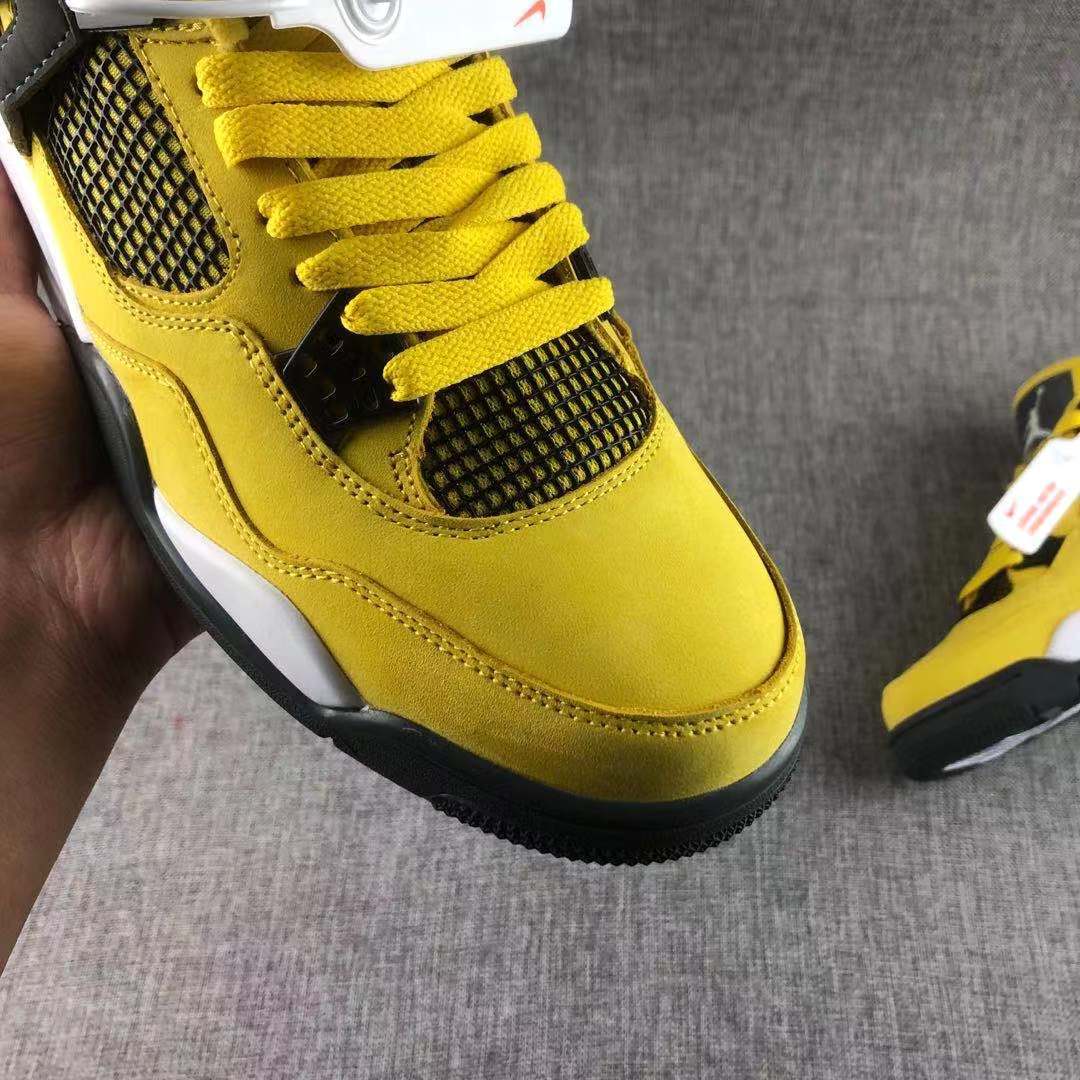Air Jordan 4 Lightning Yellow Black Sneakers - product image from the listing.