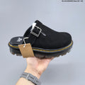 Buckle-Strap Mule Clogs in Black and Sage by Dr. Martens - product image from the listing.
