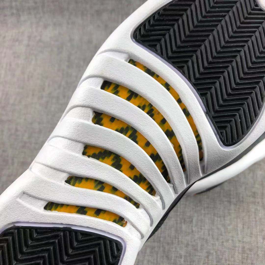 Air Jordan 12 Black Gold Sneakers 130690-017 - product image from the listing.