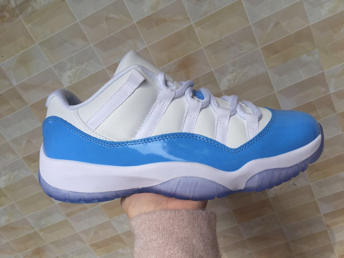 White and University Blue Jordan 11 Low Sneakers - product image from the listing.
