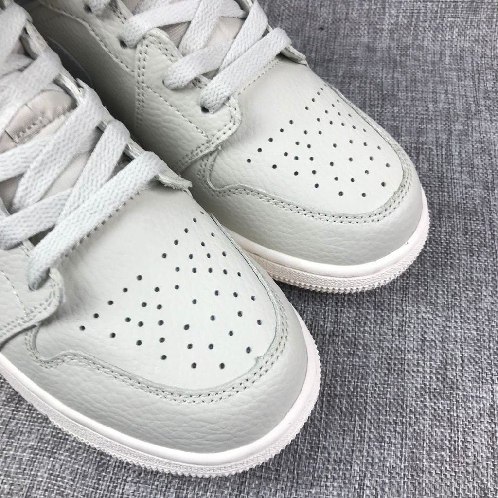White and Grey Air Jordan 1 Mid Sneakers - product image from the listing.