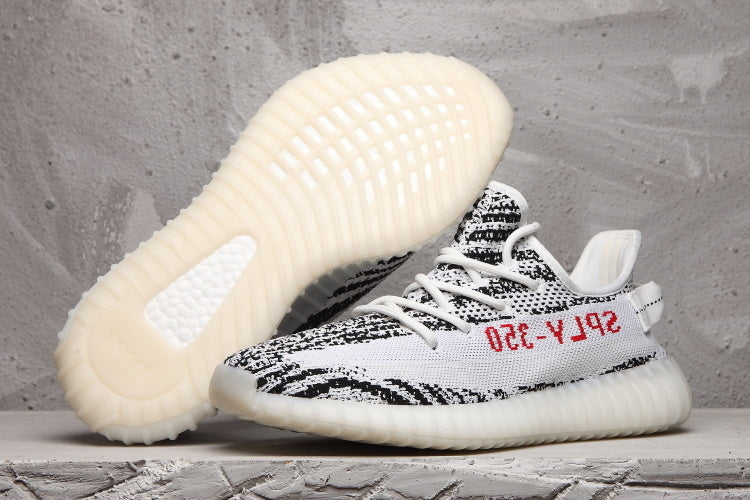 Yeezy 350 V2 Sneakers in Black and White Knit - product image from the listing.
