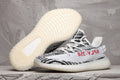 Yeezy 350 V2 Sneakers in Black and White Knit - product image from the listing.