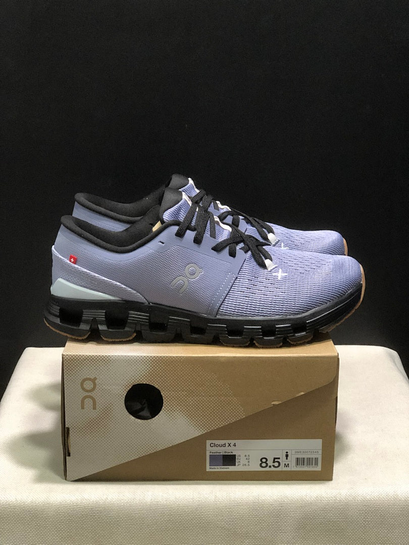 On Cloud X 4 Sneakers in Feather in Black - product image from the listing.