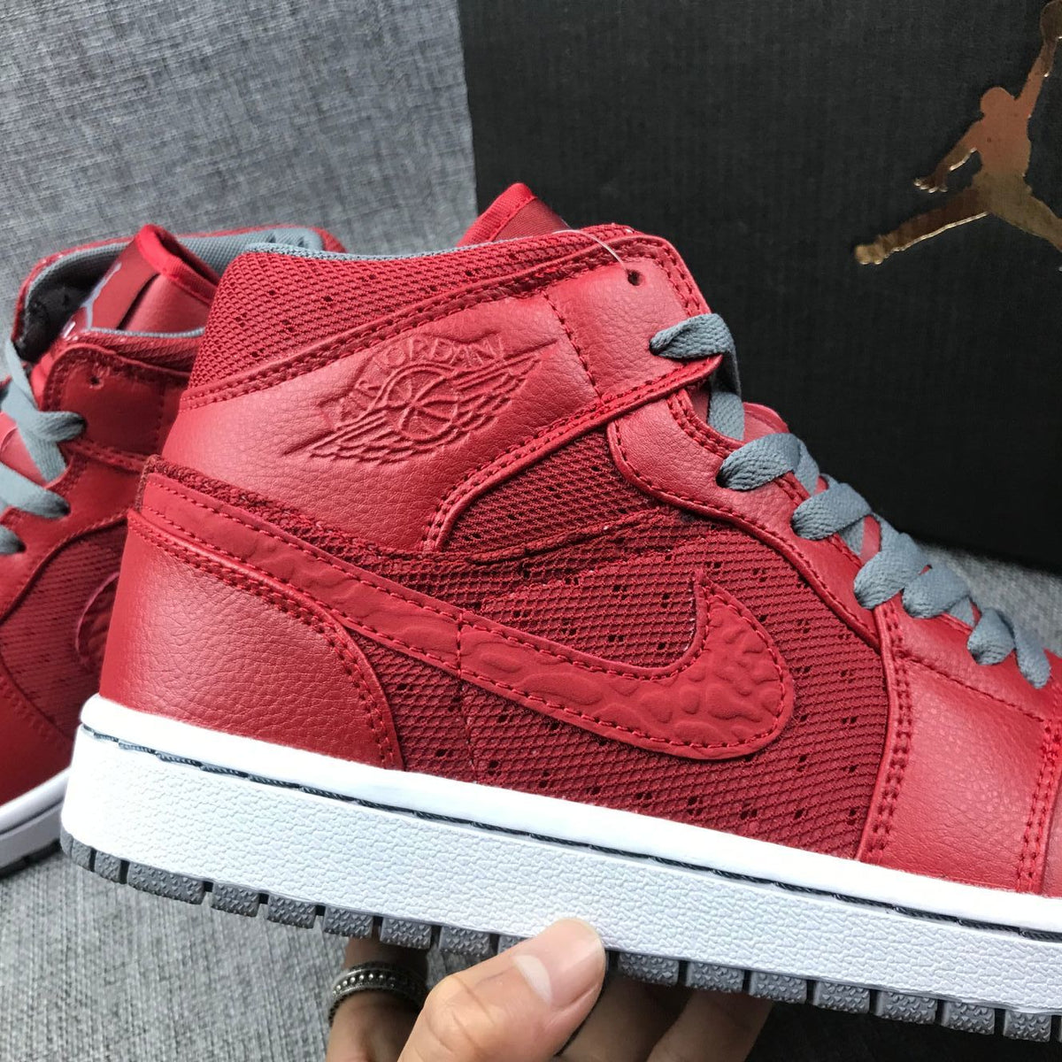 Red and Grey Jordan 1 Mid High-Top Sneakers - product image from the listing.