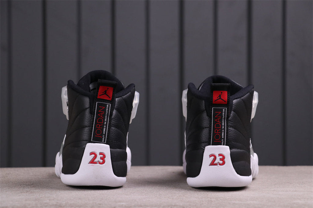 Air Jordan 12 Reverse Taxi Black White 130690-001 - product image from the listing.
