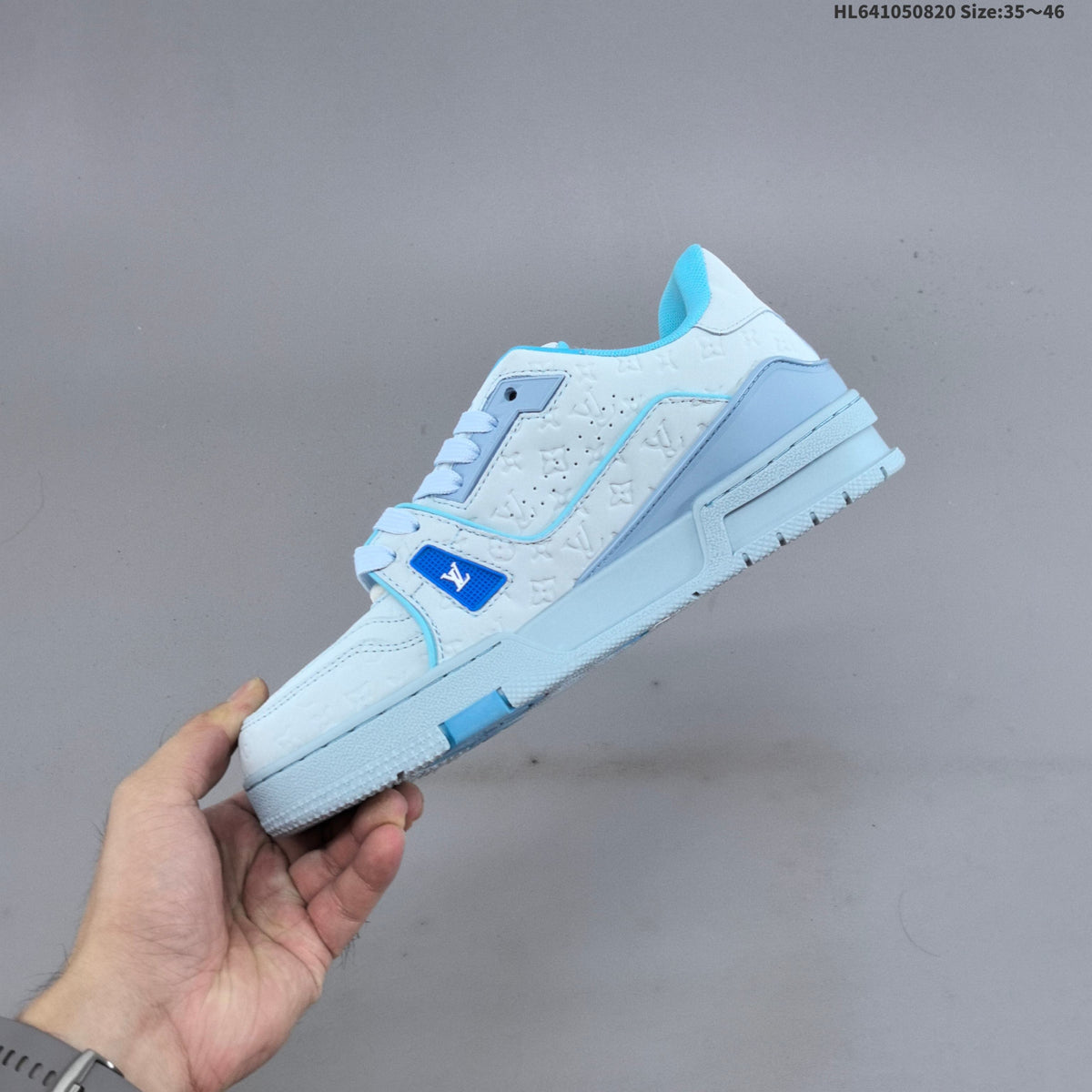 Louis Vuitton Trainer Low-Top Sneakers, in White and Green/Blue - product image from the listing.