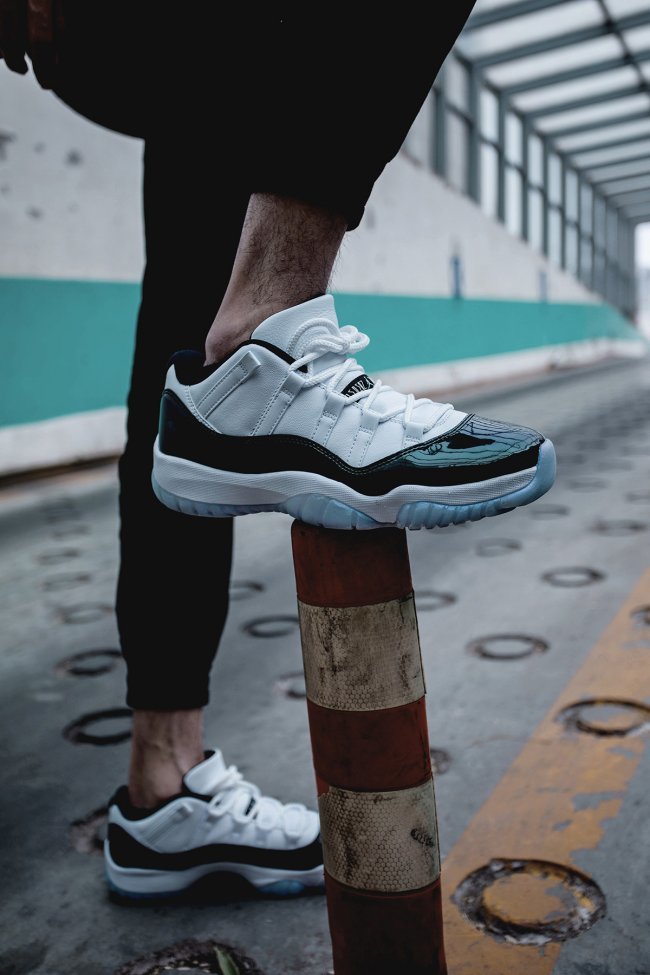 White and Black Air Jordan 11 Iridescent Sneakers - product image from the listing.