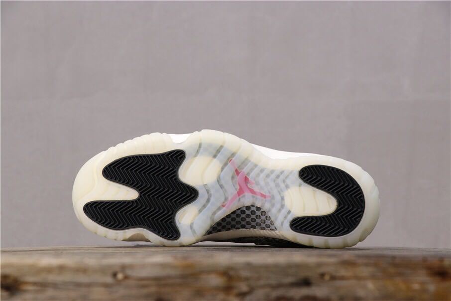 Air Jordan 11 Retro Low White Black Snakeskin Sneakers - product image from the listing.