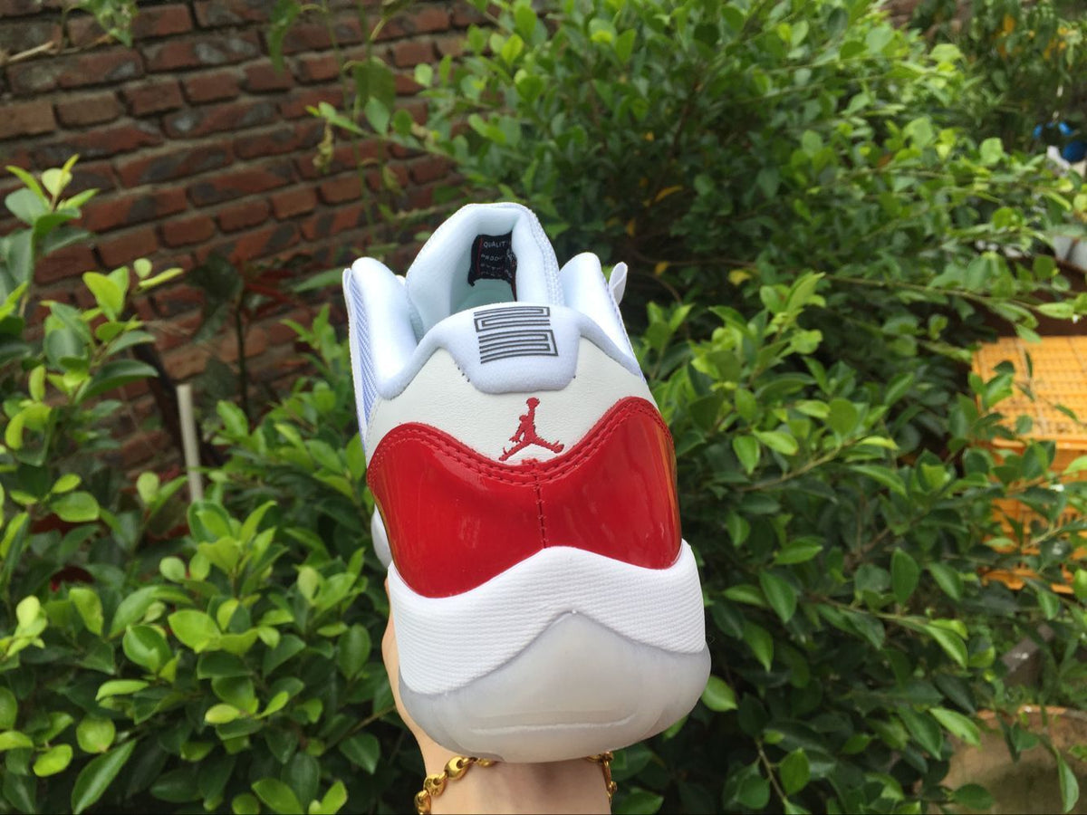 Air Jordan 11 Low Sneakers White Red - product image from the listing.